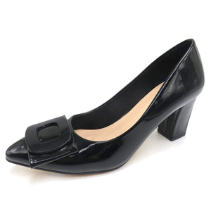 Black patent leather high heel shoe with a bow detail on a white background