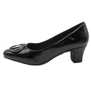Black patent leather shoe with a low heel on a white background